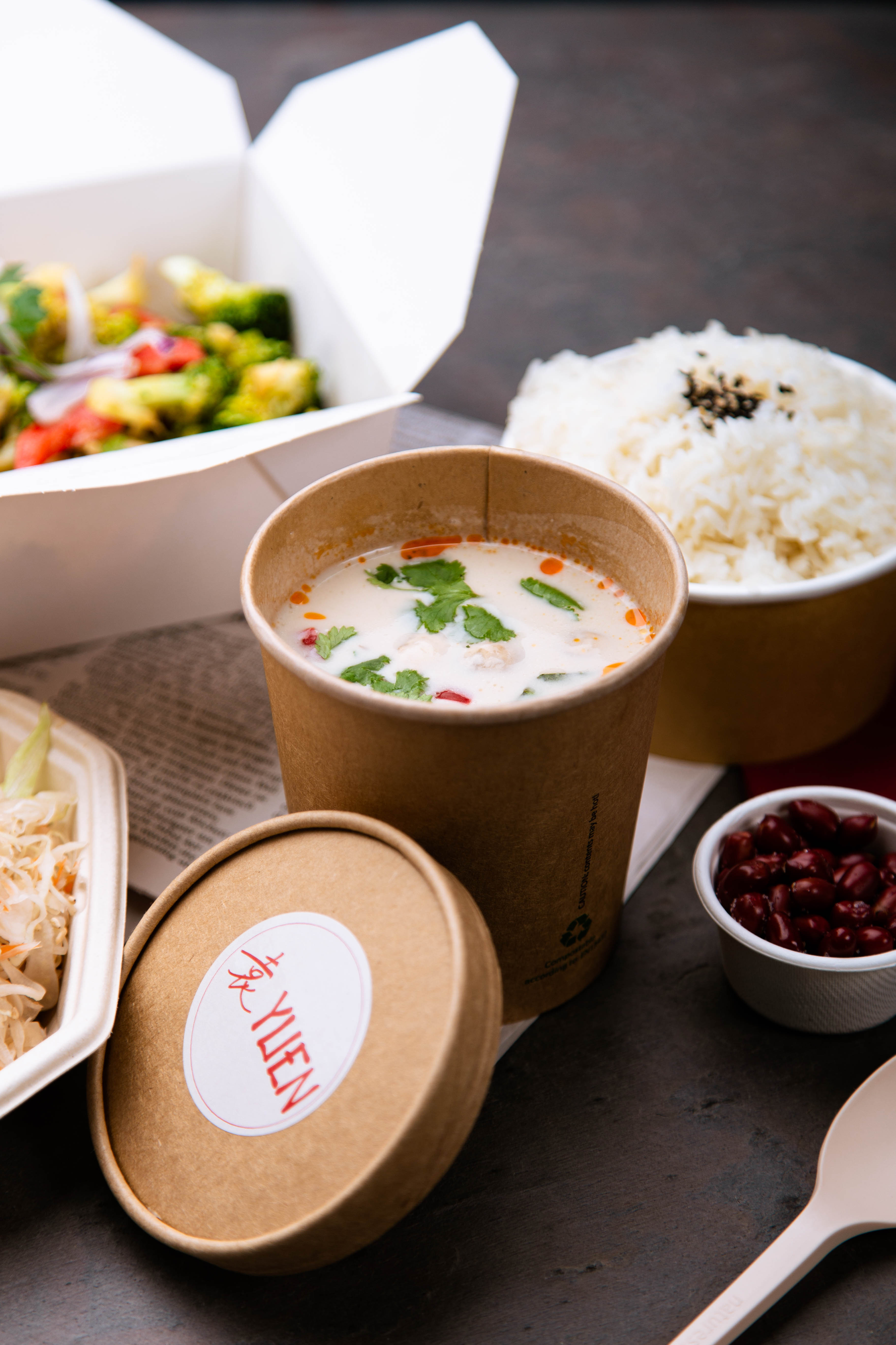 Coconut-galangal soup with peanuts as sides